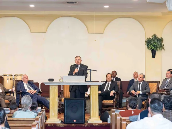Elder Runner speaking at the installation service
